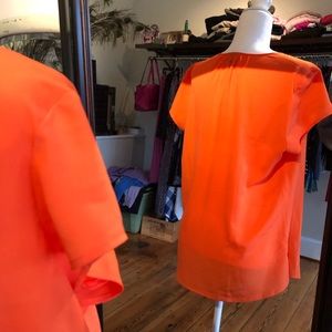 Orange zippered blouse